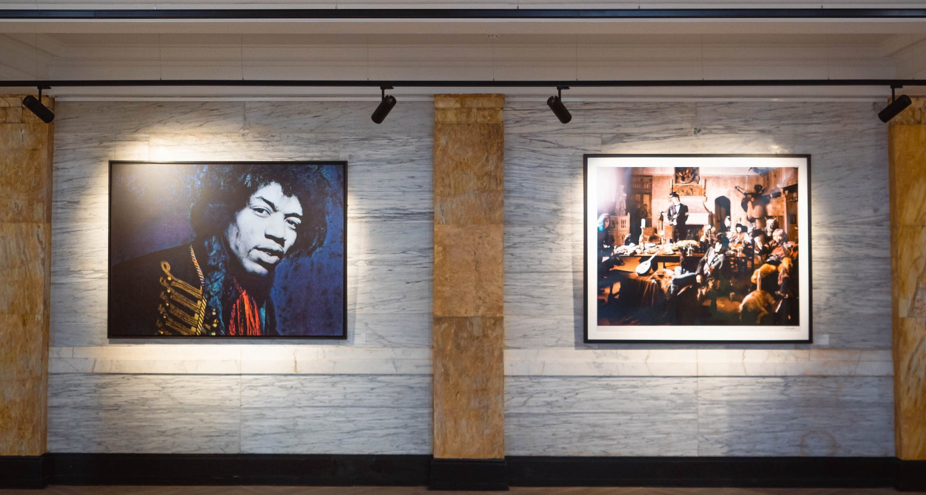 Image of the interior of London-based gallery Iconic Images, featuring two prints hanging gallery-style.