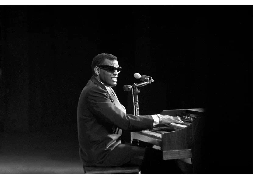 A black and white print of Ray Charles performing during a 1960 performance, captured by Ted Williams. 