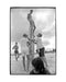 Kid sitting on surfboard while friends hold it up, Florida, 1969 — Limited Edition Print