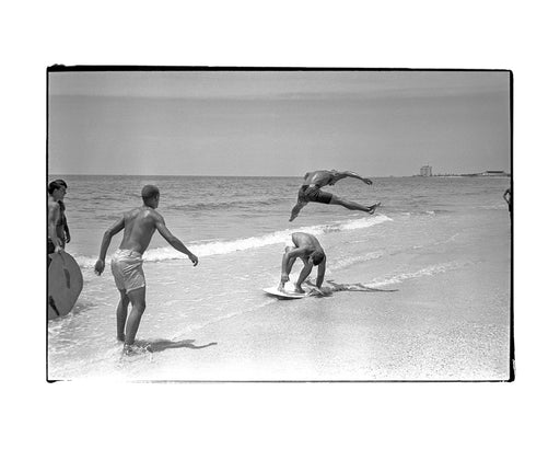 Kids doing tricks in the shallow surf, Florida, 1969 — Limited Edition Print