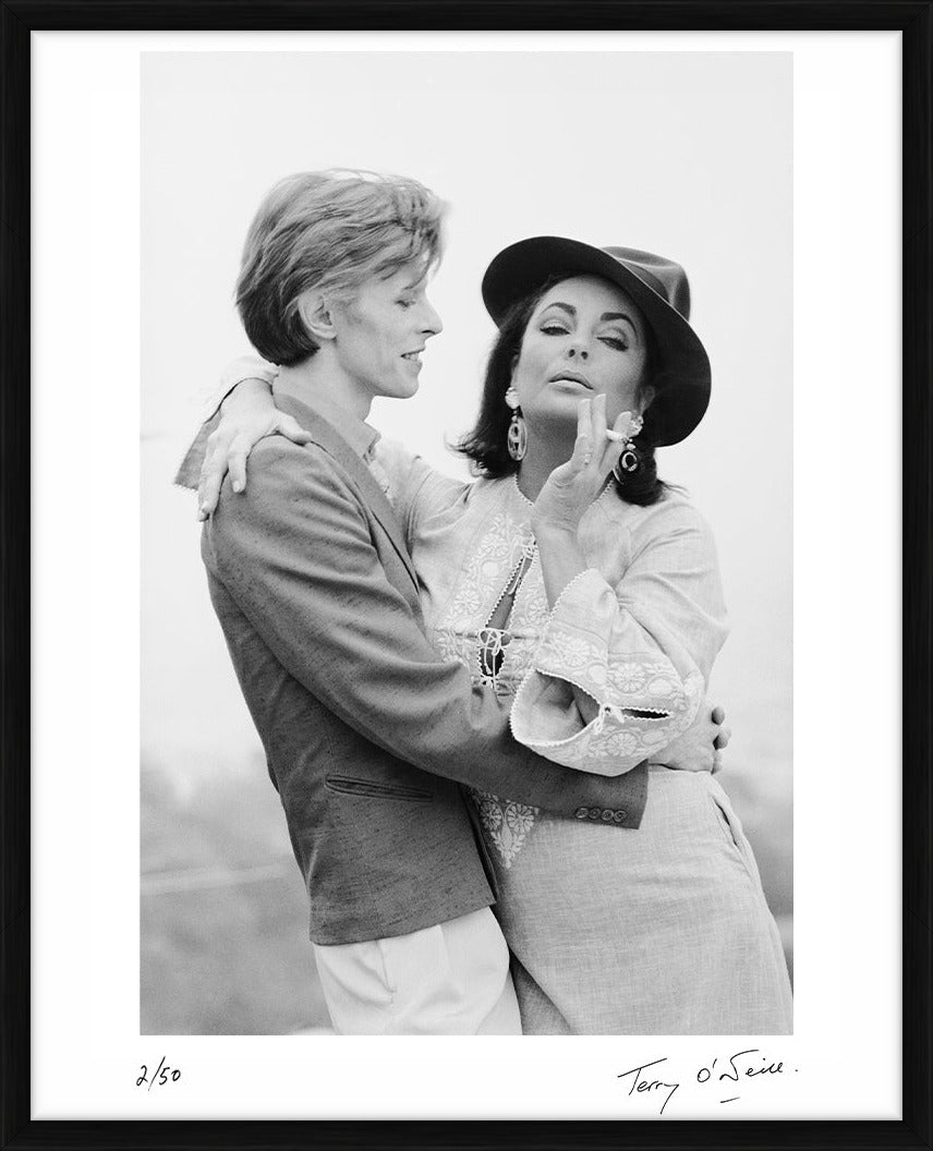 David Bowie & Elizabeth Taylor in Beverly Hills, 1975 by Terry O'Neill – Limited Edition Print.