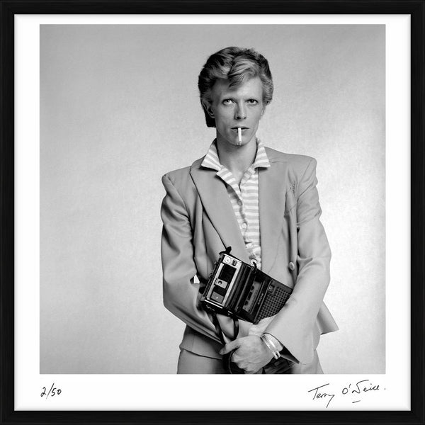David Bowie holding a cassette player, 1974 — Limited Edition Print, framed - Terry O'Neill