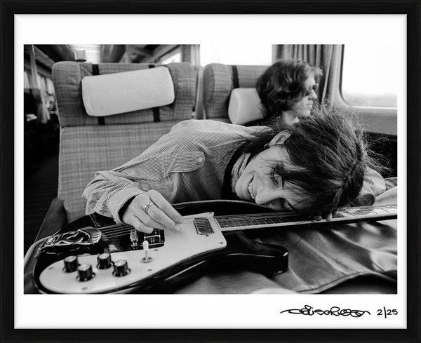 Patti Smith on a train in the UK, 1978 — Limited Edition Print, framed - Denis O'Regan