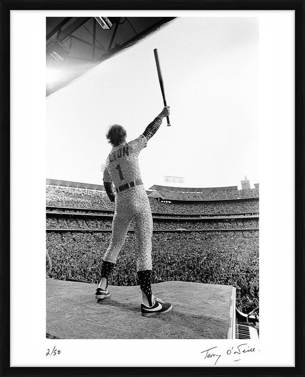 Elton John standing on a piano, 1975 — Limited Edition Print, framed - Terry O'Neill