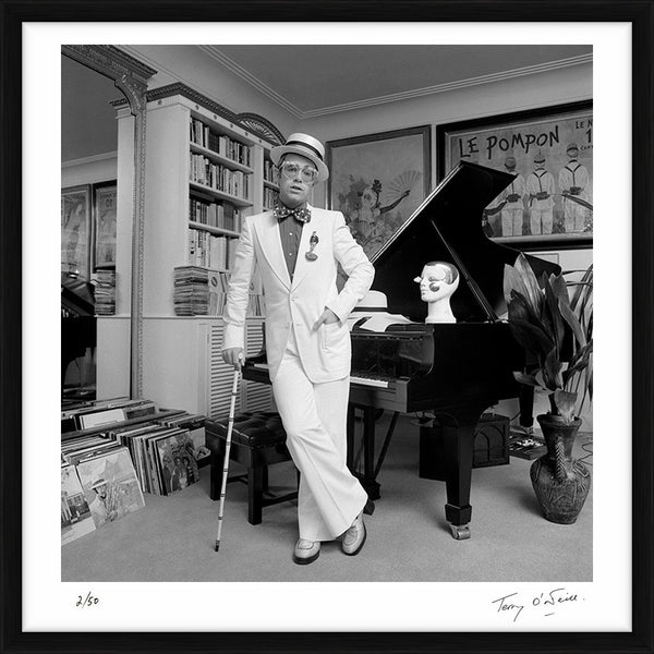 Elton John standing at his piano, 1974 — Limited Edition Print, framed - Terry O'Neill