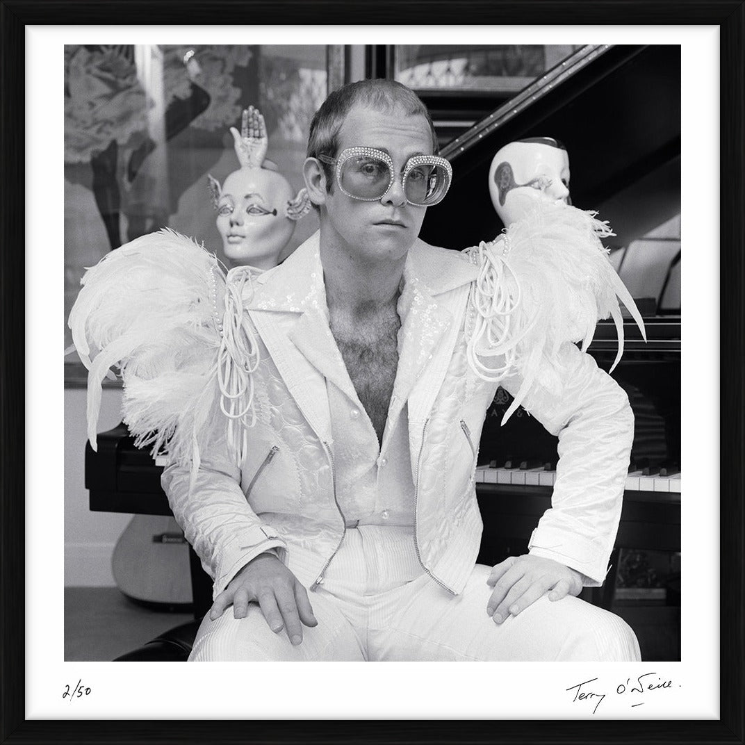 Elton John wearing a white feather suit, circa 1973 by Terry O'Neill – Limited Edition Print.