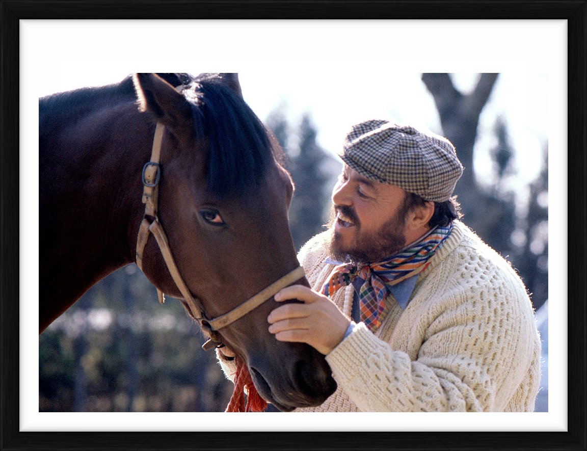Luciano Pavarotti stroking a horse by Eva Sereny – Limited Edition Print.