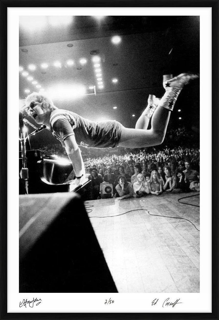 Elton John takes flight, 1970 - Co-Signed Edition Print by Ed Caraeff – Limited Edition Print.