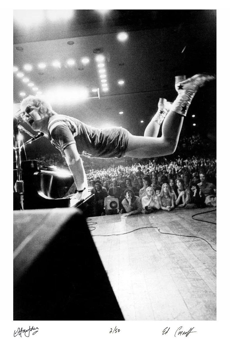 Elton John takes flight, 1970 - Co-Signed Edition Print by Ed Caraeff – Limited Edition Print.