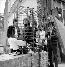 The Rolling Stones photographed behind a cage in Ormond Yard, London, 1965 — Limited Edition Print