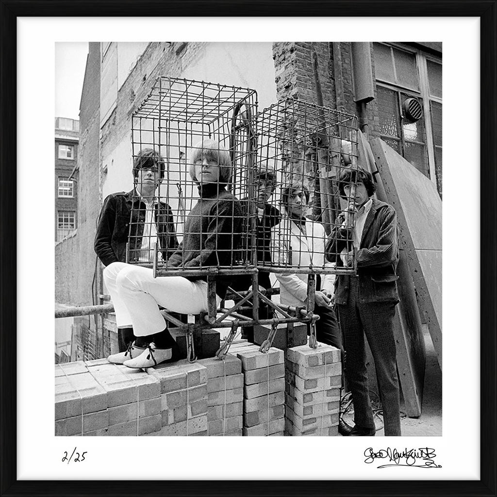 The Rolling Stones photographed behind a cage in Ormond Yard, London, 1965 – Limited Edition Print by Gered Mankowitz – Limited Edition Print.