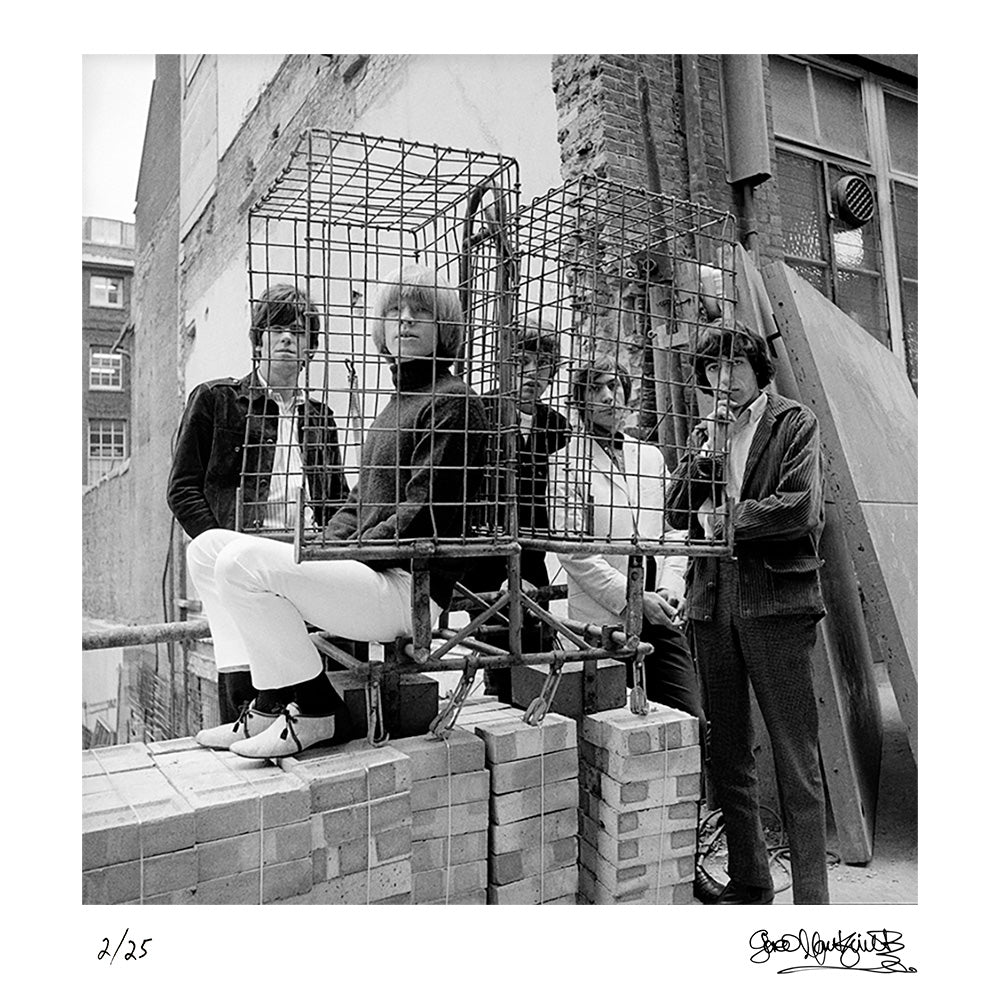 The Rolling Stones photographed behind a cage in Ormond Yard, London, 1965 by Gered Mankowitz – Limited Edition Print.