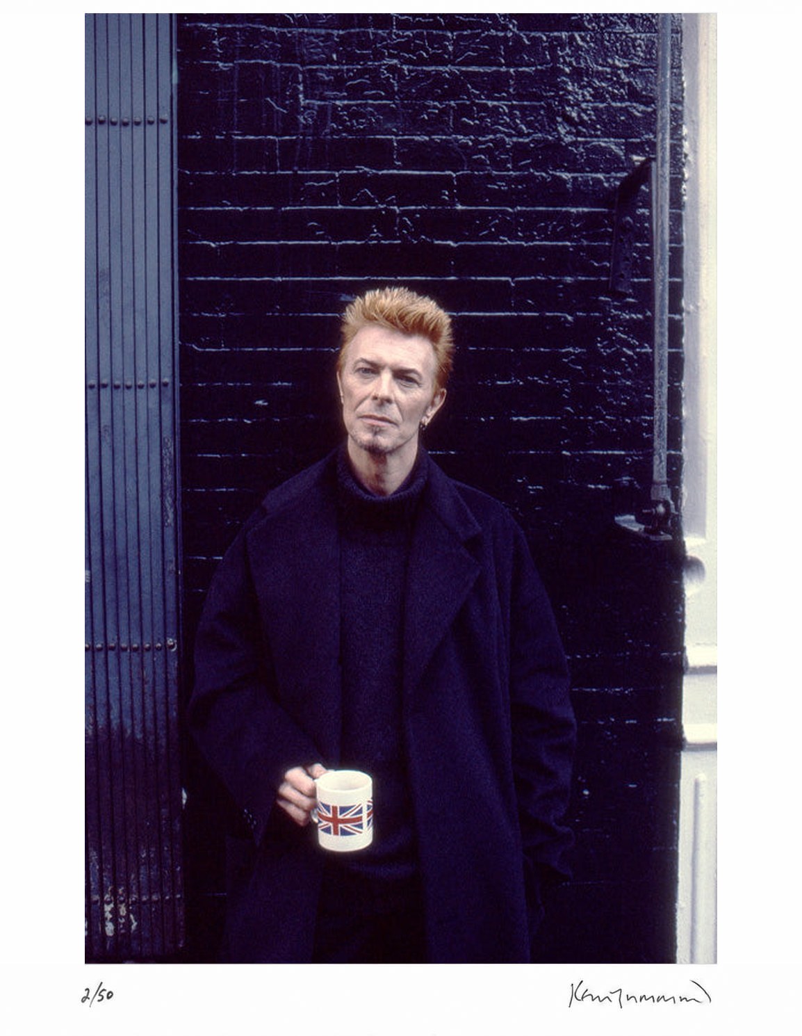 David Bowie in New York City, in front of Tea and Sympathy, 1997 by Kevin Cummins – Limited Edition Print.