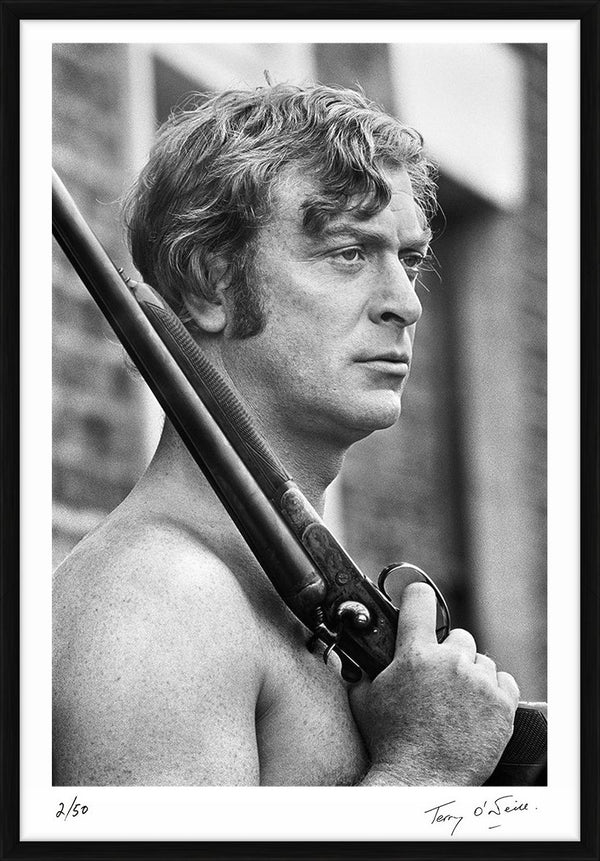 Michael Caine holding a rifle, 1970 — Limited Edition Print, framed - Terry O'Neill