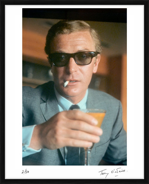 Michael Caine filming Funeral in Berlin (colourised), 1966 — Limited Edition Print, framed - Terry O'Neill