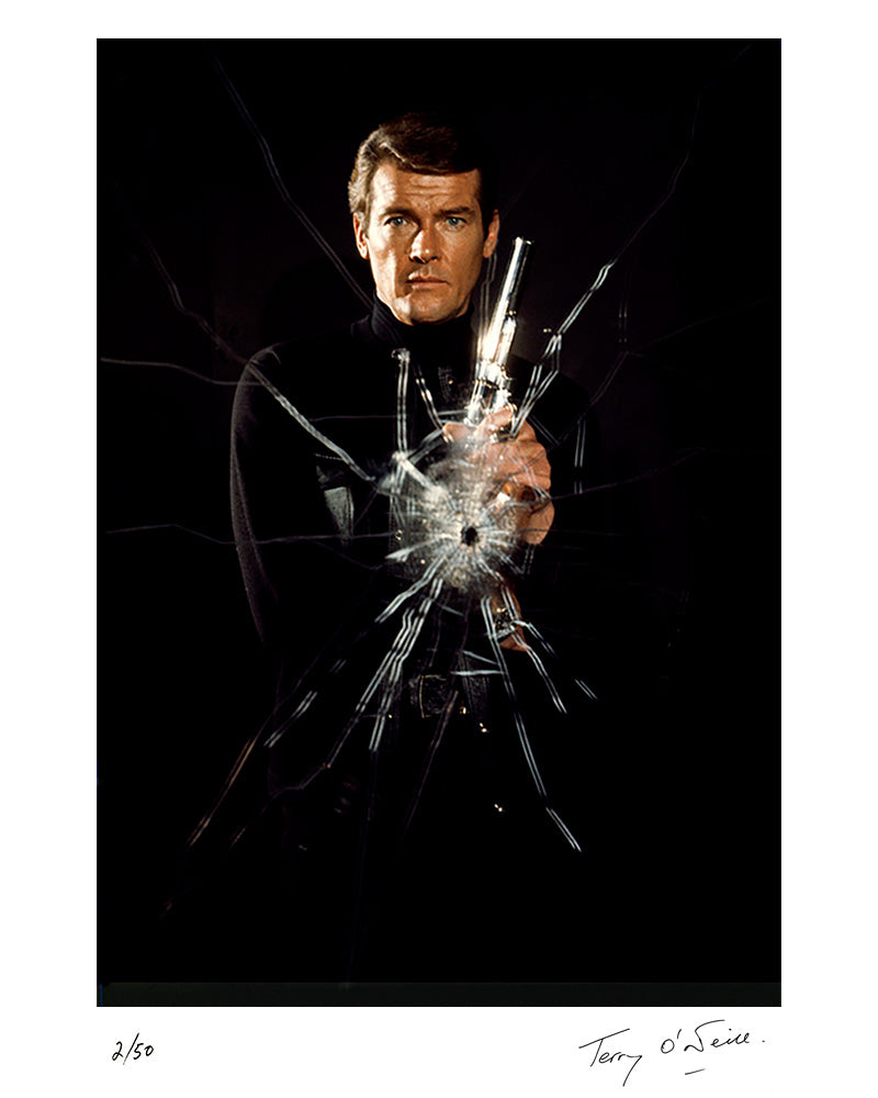 Roger Moore as James Bond poses as superspy on the film set of 'Live and let die', 1973 by Terry O'Neill – Limited Edition Print.