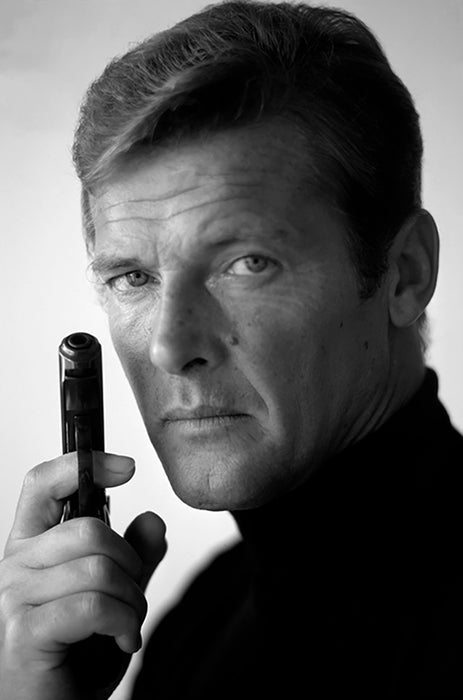 Roger Moore as James Bond, with his weapon of choice, December 1972 — Limited Edition Print