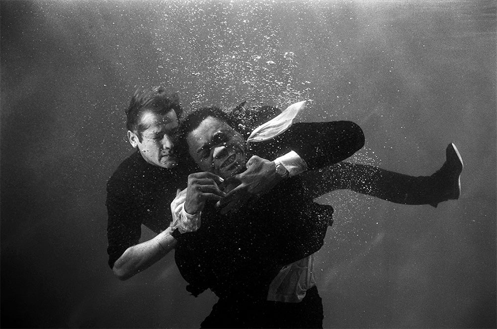 Roger Moore as James Bond underwater on the film set of 'Live and let die', 1973 by Terry O'Neill – Limited Edition Print.