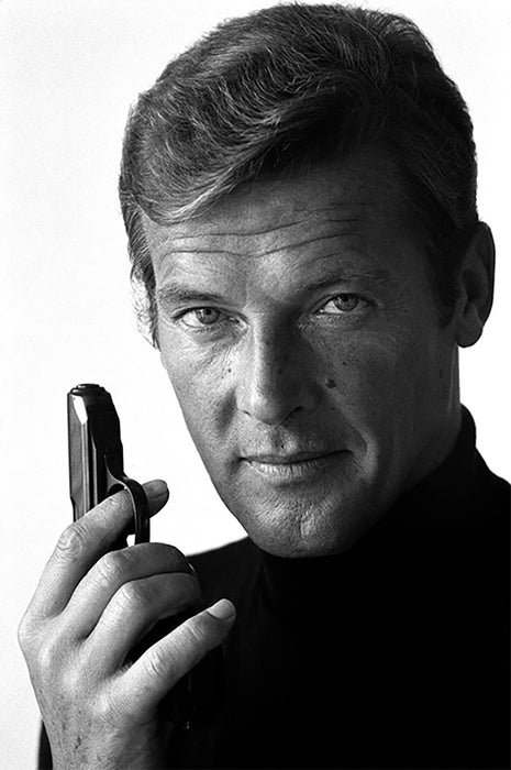 Roger Moore as James Bond poses with his weapon of choice, December 1972 — Limited Edition Print