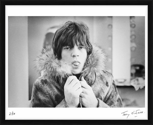 Mick Jagger poking his tongue out, 1964 — Limited Edition Print, framed - Terry O'Neill