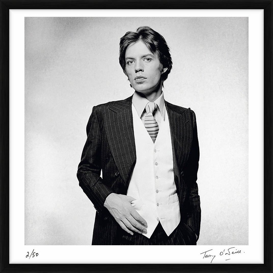 Rolling Stones singer Mick Jagger dressed in a pinstripe suit, 1976 by Terry O'Neill – Limited Edition Print.