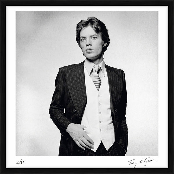 Mick Jagger dressed in a pinstripe suit, 1976 — Limited Edition Print, framed - Terry O'Neill
