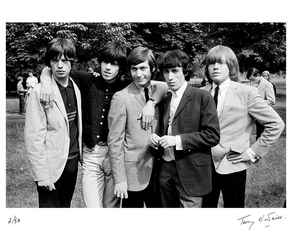 The Rolling Stones pose for a group portrait in Regent's Park, London in July 1964 by Terry O'Neill – Limited Edition Print.