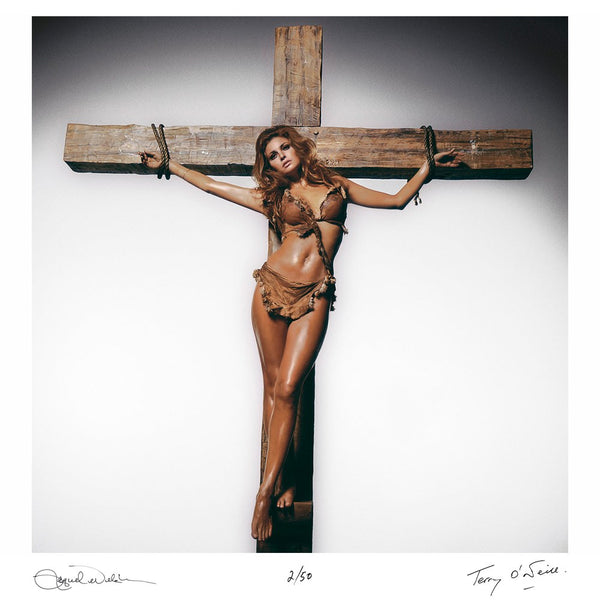 Raquel Welch crucifixion (colourised) — Co-Signed Edition Print, signed by Raquel Welch and Terry O'Neill - Terry O'Neill