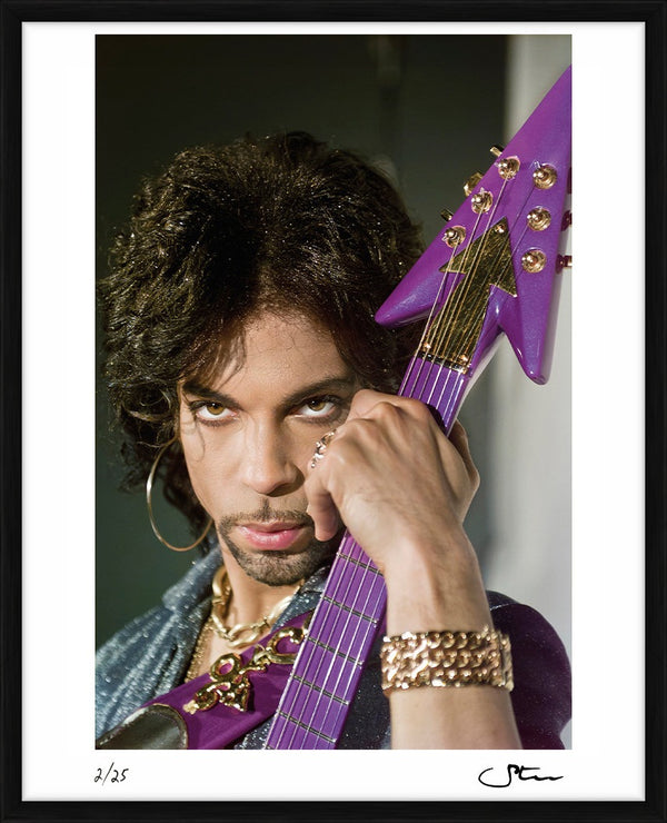 Prince with his purple symbol guitar, 1999 — Limited Edition Print, framed - Steve Parke