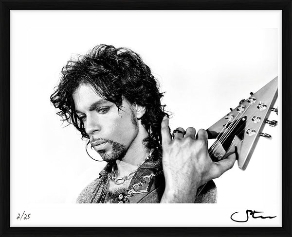 Prince posing with his Auerswald symbol guitar, 1999 — Limited Edition Print, framed - Steve Parke