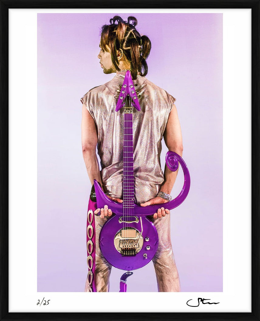 Prince with his signature guitar behind his back - Limited Edition Print by Steve Parke – Limited Edition Print.