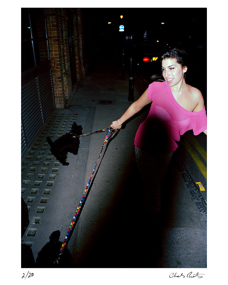 Amy Winehouse on Princelet Street, Brick Lane in East London, 2003 by Charles Moriarty – Limited Edition Print.