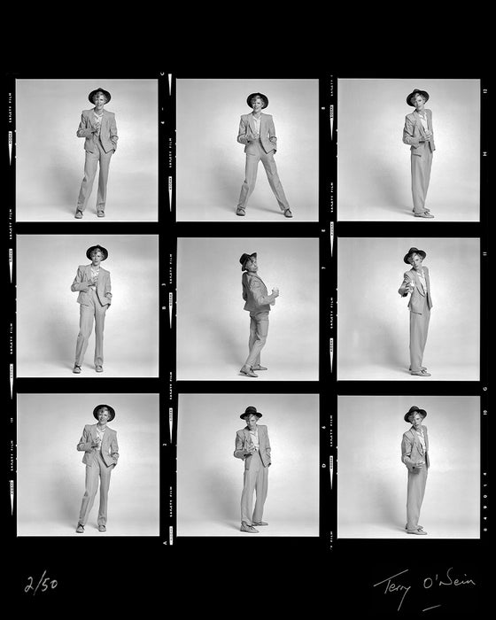  David Bowie holding a glass contact sheet, 1974 — Limited Edition Print - Terry O'Neill