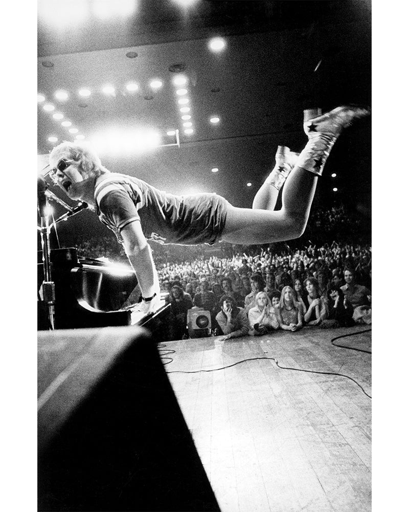 Elton John takes flight, 1970 — Limited Edition Print - Ed Caraeff