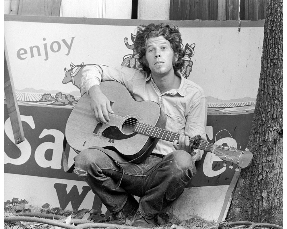 Tom Waits with his guitar, 1972 by Ed Caraeff – Limited Edition Print.