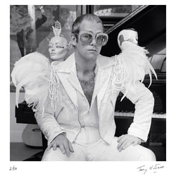 Elton John wearing a white feather suit, circa 1973 - Limited Edition Print by Terry O'Neill – Limited Edition Print.