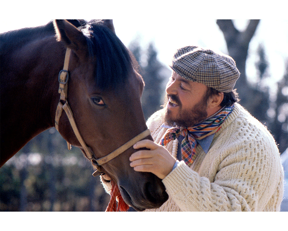 Luciano Pavarotti stroking a horse by Eva Sereny – Limited Edition Print.