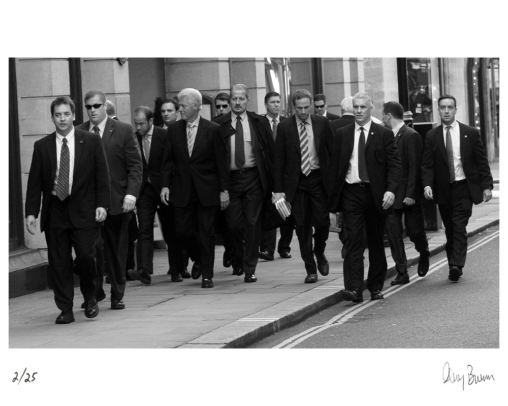 Bill Clinton walking on Jermyn Street, 2007 by Greg Brennan – Limited Edition Print.