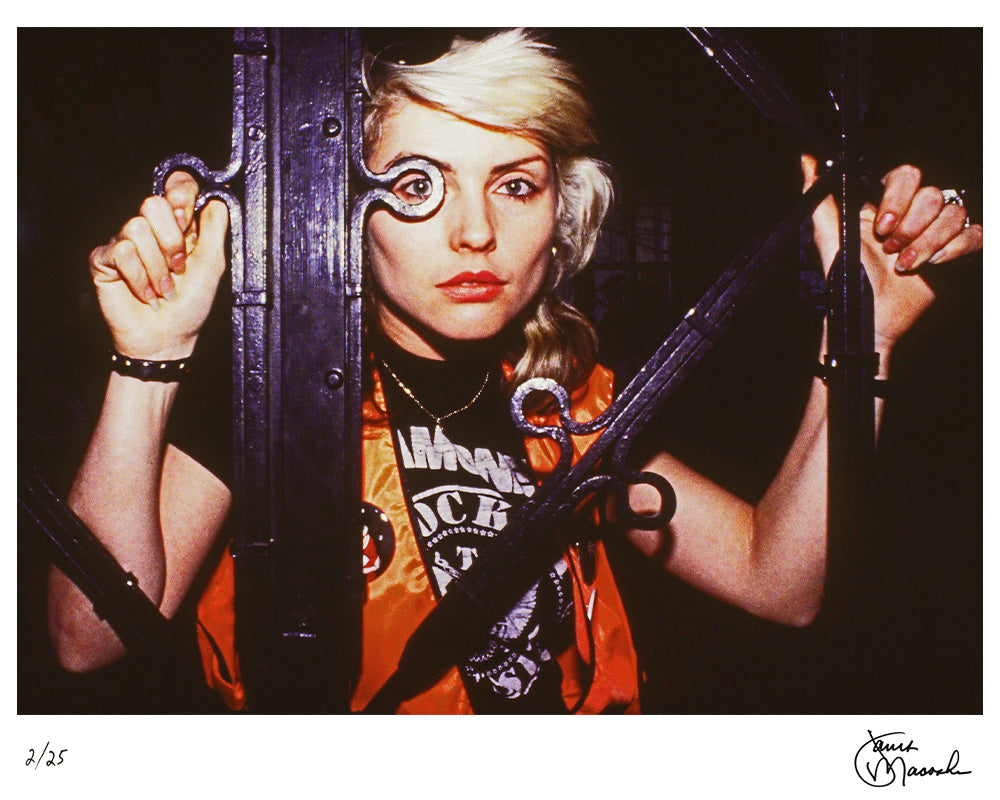 Debbie Harry peaking through an iron fence, 1978 — Limited Edition Print - Janet Macoska