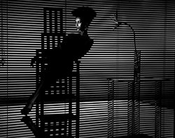 Iman in the shadows, 1984 - Limited Edition Print by John Swannell – Limited Edition Print.