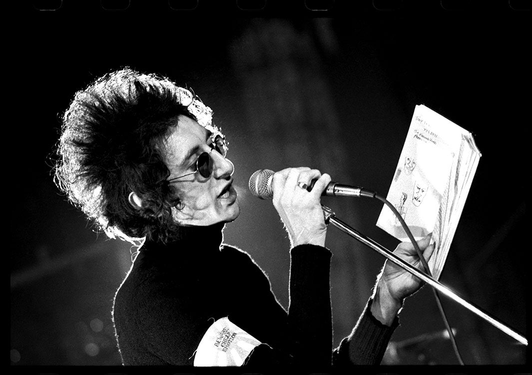 John Cooper-Clarke on stage at Elizabethan Hall, 1977 — Limited Edition Print - Kevin Cummins