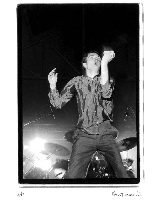 Ian Curtis performing at the Futurama One Festival, 1979 — Limited Edition Print - Kevin Cummins