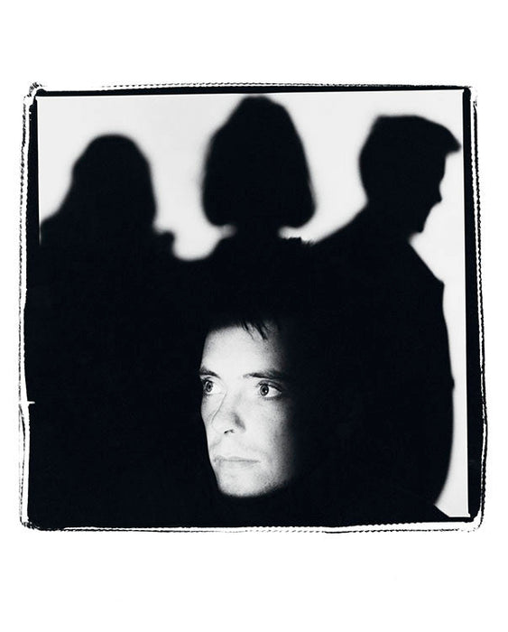 Bernard Sumner with the band in shadow, 1985 — Limited Edition Print - Kevin Cummins