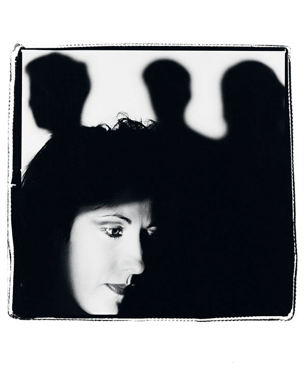 Gillian Gilbert with the band in shadow, 1985 by Kevin Cummins – Limited Edition Print.