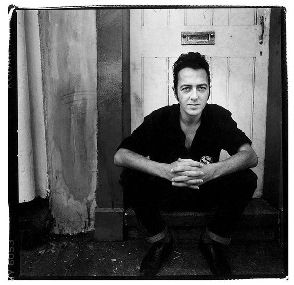 Joe Strummer on a stoop in London, 1989 — Limited Edition Print - Kevin Cummins
