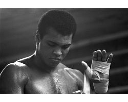 Muhammad Ali taping his hands, 1977 - Limited Edition Print by Michael Brennan – Limited Edition Print.