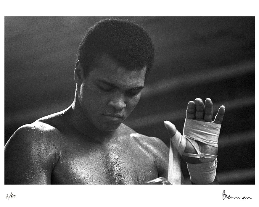 Muhammad Ali taping his hands, 1977 — Limited Edition Print - Michael Brennan