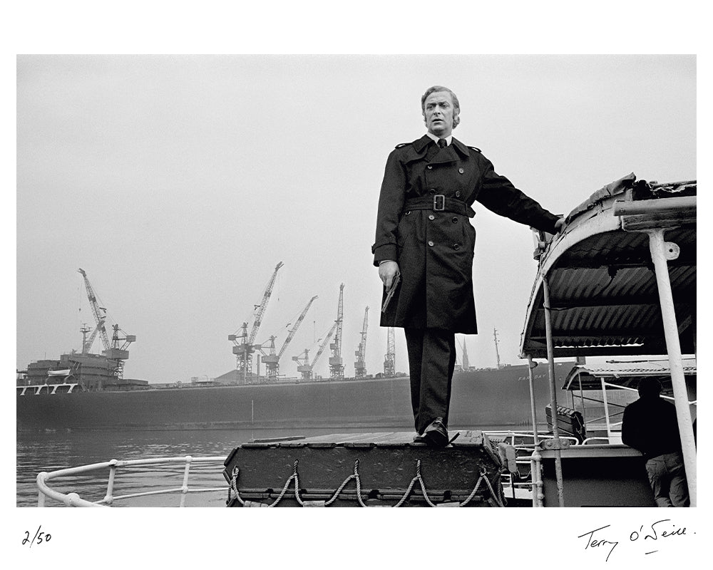 Michael Caine stands on a boat, 1970 by Terry O'Neill – Limited Edition Print.