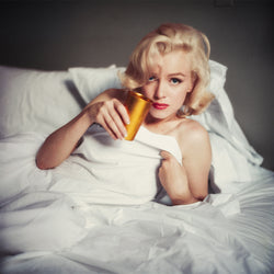Marilyn Monroe laying in bed, 1953 - Limited Edition Print by Milton H. Greene – Limited Edition Print.