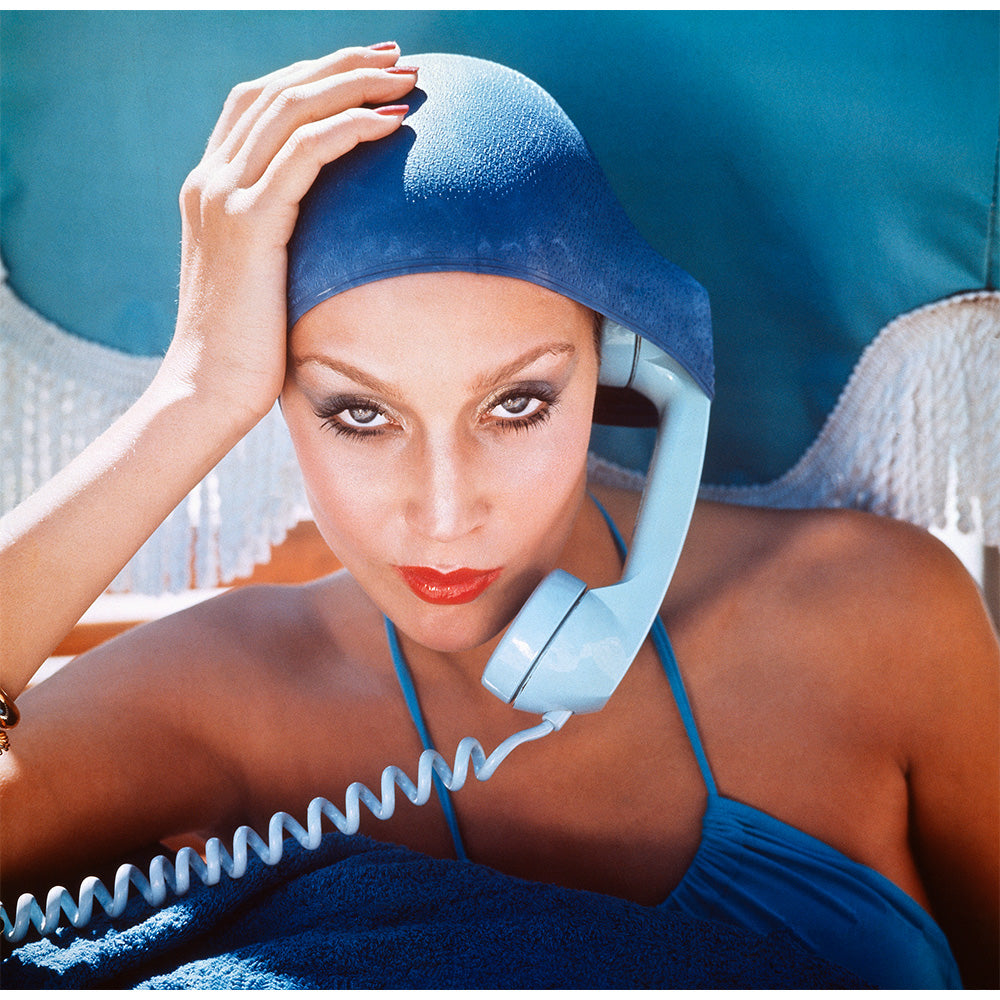 Jerry Hall takes a call in the pool, 1975 by Norman Parkinson – Limited Edition Print.